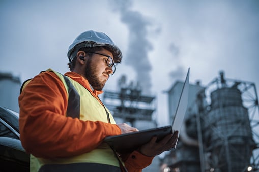 Construction worker using a laptop